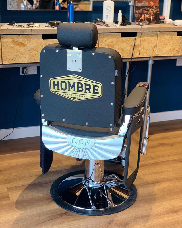 black mans barbers chair with brand logo embroidery