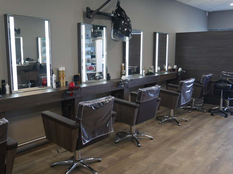 hair salon room with salon chairs and mirrors